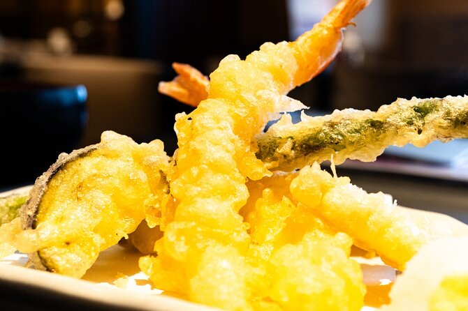 Kyoto: Gion Local Food Tour (Taste 15 Dishes) - Walking toward Yasaka Shrine between courses