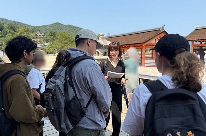 Miyajima Guided Tour and Fresh Oyster Farm Tour - Grilling oysters at Shimada Suisan