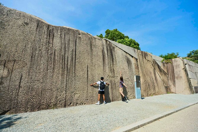 Osaka Castle Walking Tour and Castle Tower Admission - Walking through the castle grounds