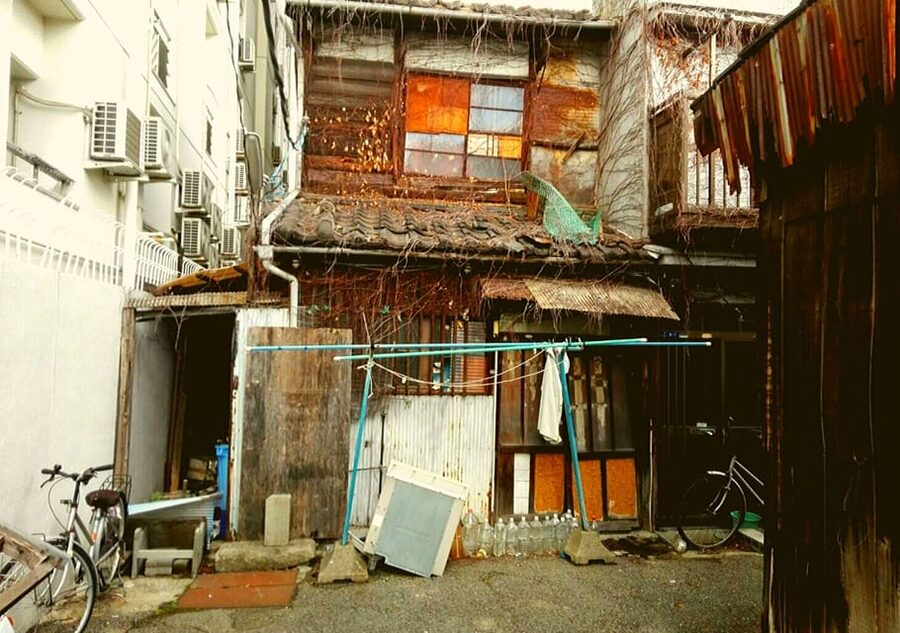 Osaka: Deep Backstreets Walking Tour with Dinner Option - Abandoned buildings and the uneasy middle of Osaka
