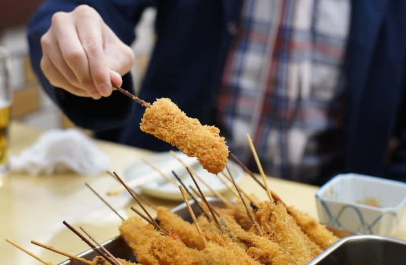 Osaka: Food Tour Kuromon Market & Dotonbori with Guide - Kuromon Market and Wanaka’s takoyaki