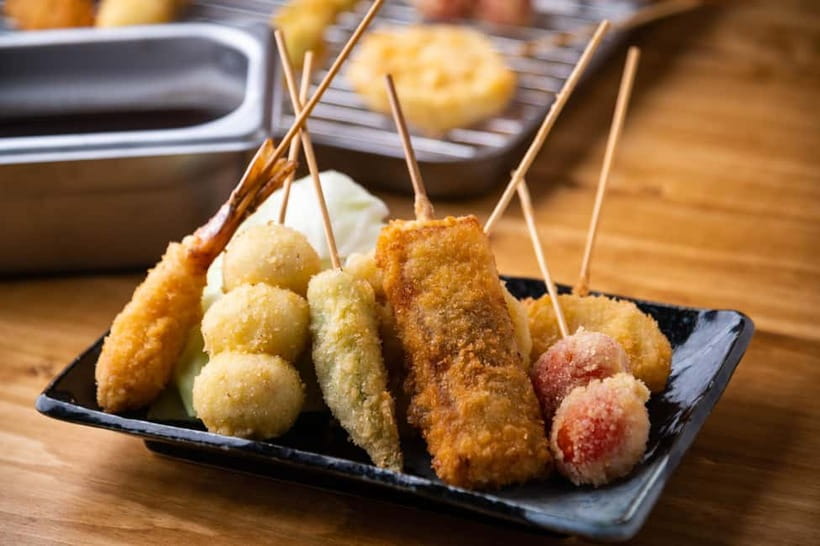 Osaka: Food Tour Kuromon Market & Dotonbori with Guide - Dotonbori after dark