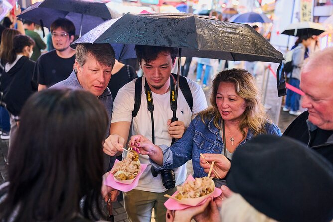Osaka: Guided Food Tour with 12 Dishes at 4 Local Eateries - Fresh fish and small plates at local eateries