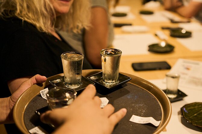 Osaka: Guided Food Tour with 12 Dishes at 4 Local Eateries - Stop one: local restaurant food with a guide