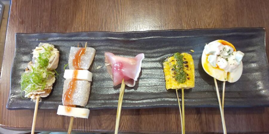 Osaka: Shinsekai Food Tour with 13-15 Dishes at 5 Eateries - Stop four: specialist gyoza in a small setting