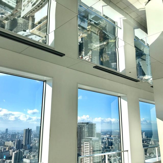 Osaka: Umeda Sky Building Official E-Ticket - Going up through glass and escalators