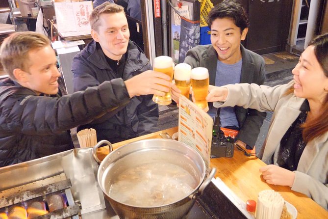 Tokyo Bar Hopping Tour in Shinjuku (All-You-Can-Drink + Dinner) - Starting beside the black pillar in Shinjuku