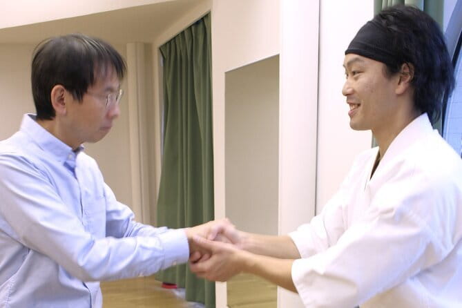 Tokyo: Karate Experience with Former All-Japan Champion - Stretching prepares your body for kicks