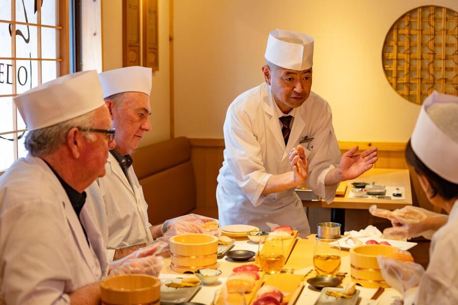 Tokyo Professional Sushi Chef Experience - Forming hand-rolled sushi with premium nori