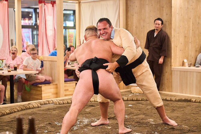 TokyoSumoShow, ChickenHotPot, and Mochi-Pounding by Pro Wrestlers - Sumo demonstrations explain why the sport is difficult